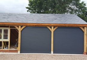 Fitting two roller doors on a barn in Anthracite